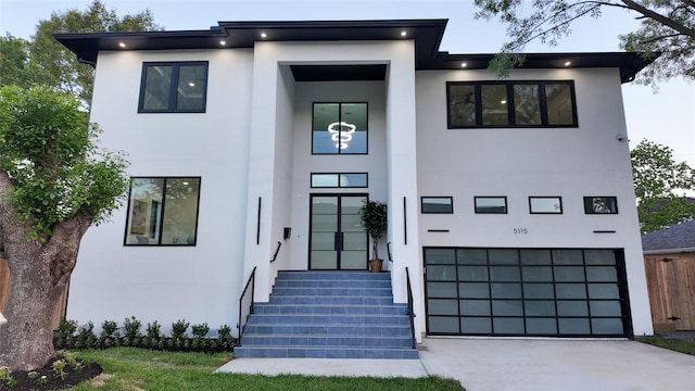 5115 Maple St, Houston, TX 77401 - modern home featuring stucco siding, an attached garage, and concrete driveway