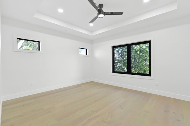 5115 Maple St, Houston, TX 77401 - unfurnished room with a raised ceiling, light wood-type flooring, recessed lighting, and a ceiling fan