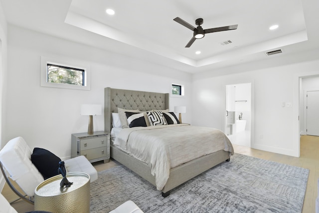 5115 Maple St, Houston, TX 77401 - bedroom featuring a raised ceiling, light wood-style floors, recessed lighting, a ceiling fan, and ensuite bathroom