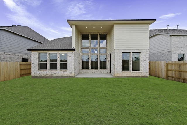 3244 Stingray Cove Dr, Katy, TX 77493 - rear view of property featuring a fenced backyard, brick siding, and a patio
