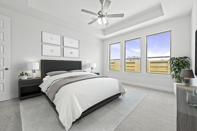 3244 Stingray Cove Dr, Katy, TX 77493 - bedroom with a raised ceiling, light colored carpet, and a ceiling fan