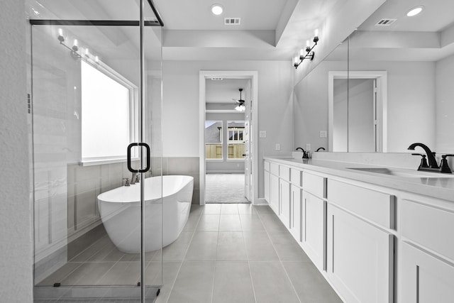 3244 Stingray Cove Dr, Katy, TX 77493 - full bath with a freestanding tub, double vanity, tile patterned flooring, a ceiling fan, and a stall shower
