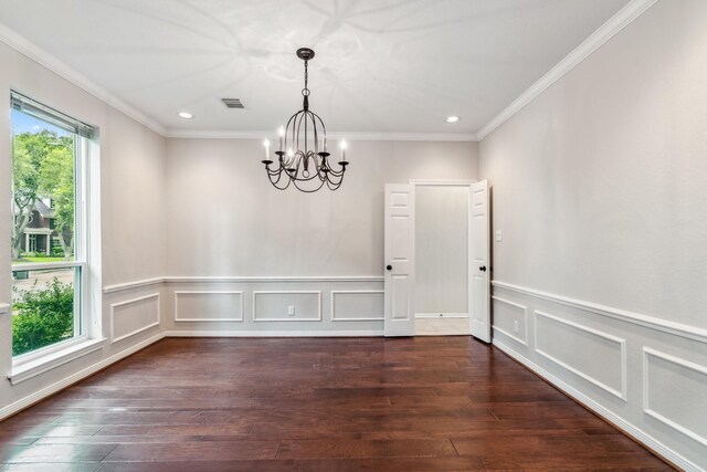 4022 Bountiful Crest Ln, Sugar Land, TX 77479 - empty room with a chandelier, wood-type flooring, recessed lighting, ornamental molding, and a decorative wall