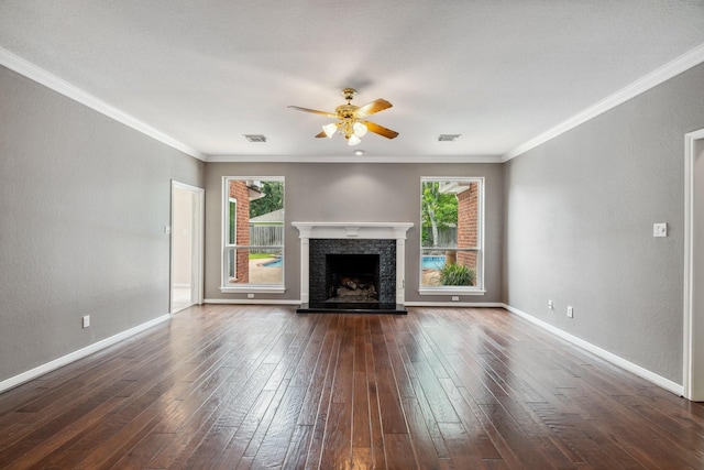 4022 Bountiful Crest Ln, Sugar Land, TX 77479 - unfurnished living room featuring ceiling fan, dark wood-style floors, a fireplace with raised hearth, and ornamental molding