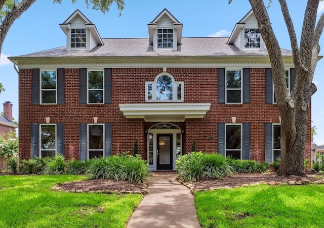 4022 Bountiful Crest Ln, Sugar Land, TX 77479 - georgian-style home featuring brick siding and a front yard