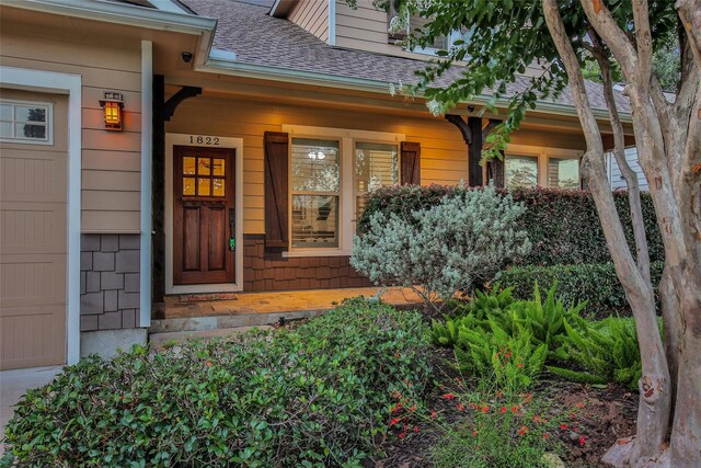 1822 Gardenia Dr, Houston, TX 77018 - property entrance featuring roof with shingles and a porch