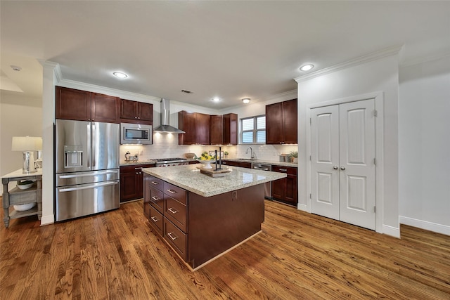 1822 Gardenia Dr, Houston, TX 77018 - kitchen featuring appliances with stainless steel finishes, wall chimney range hood, ornamental molding, dark wood-style flooring, and decorative backsplash