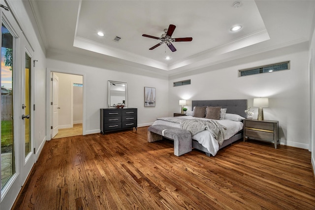 1822 Gardenia Dr, Houston, TX 77018 - bedroom with a raised ceiling, dark wood-style floors, ornamental molding, recessed lighting, and multiple windows