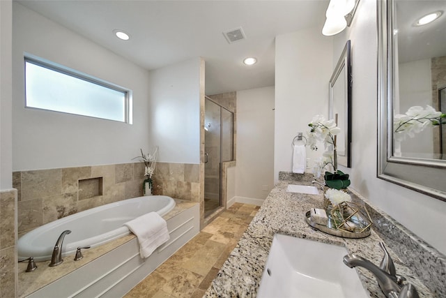 1822 Gardenia Dr, Houston, TX 77018 - bathroom featuring a garden tub, a shower stall, stone tile floors, double vanity, and recessed lighting