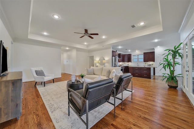 1822 Gardenia Dr, Houston, TX 77018 - living area with a tray ceiling, a ceiling fan, wood finished floors, ornamental molding, and recessed lighting