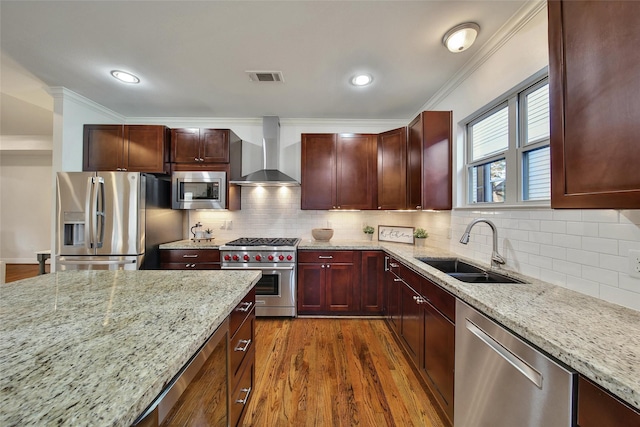 1822 Gardenia Dr, Houston, TX 77018 - kitchen with stainless steel appliances, wall chimney exhaust hood, crown molding, dark wood-type flooring, and light stone counters