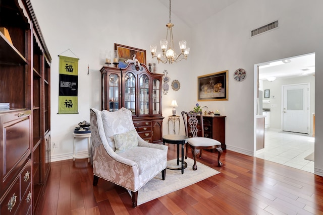 10918 Francoise Blvd, Houston, TX 77042 - sitting room with high vaulted ceiling, a chandelier, and wood-type flooring