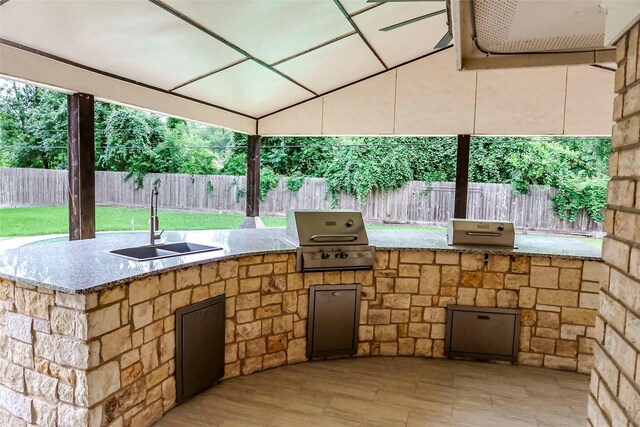 12110 Timberlake Dr, Cypress, TX 77429 - fenced backyard featuring a sink and an outdoor kitchen