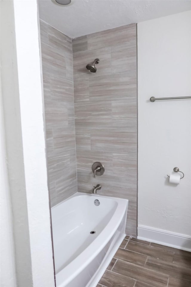 12110 Timberlake Dr, Cypress, TX 77429 - bathroom with shower / bathtub combination and wood finish floors