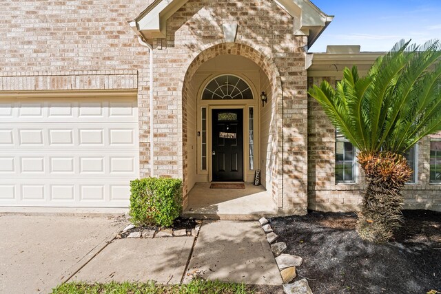 1627 Pebble Brk, Missouri City, TX 77459 - view of exterior entry with brick siding and a garage