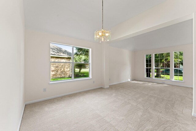 1627 Pebble Brk, Missouri City, TX 77459 - spare room featuring carpet flooring, a chandelier, and vaulted ceiling