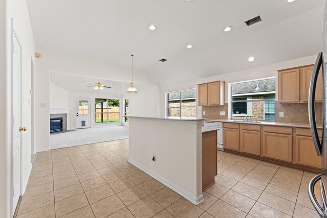 1627 Pebble Brk, Missouri City, TX 77459 - kitchen with dishwasher, light tile patterned flooring, light countertops, vaulted ceiling, and recessed lighting