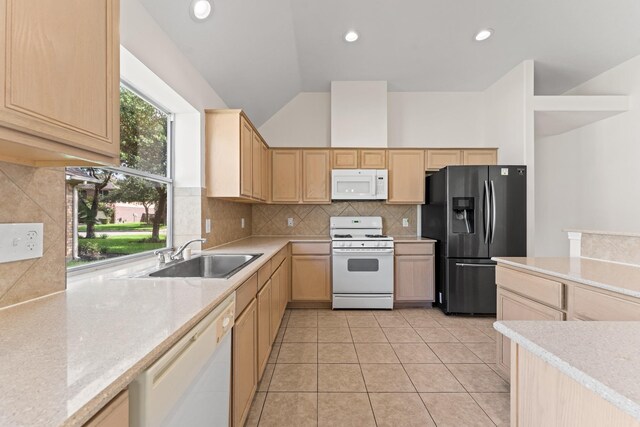 1627 Pebble Brk, Missouri City, TX 77459 - kitchen featuring white appliances, light brown cabinets, light countertops, vaulted ceiling, and recessed lighting