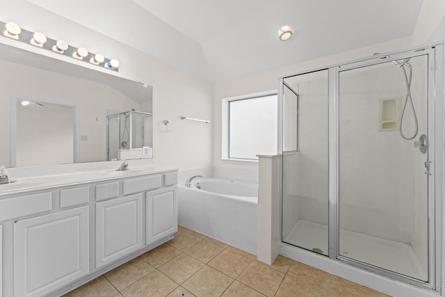 1627 Pebble Brk, Missouri City, TX 77459 - bathroom featuring a stall shower, tile patterned flooring, a bath, double vanity, and vaulted ceiling