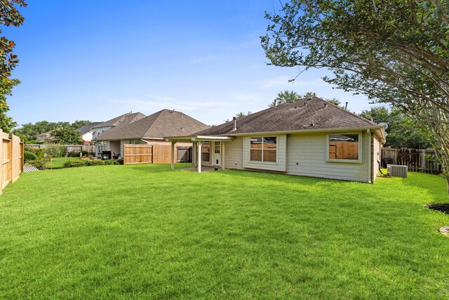 1627 Pebble Brk, Missouri City, TX 77459 - rear view of house with a fenced backyard and a shingled roof