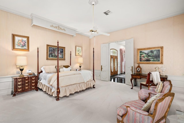 903 Rocky River Rd, Houston, TX 77056 - bedroom with carpet flooring, ornamental molding, a decorative wall, a wainscoted wall, and a ceiling fan