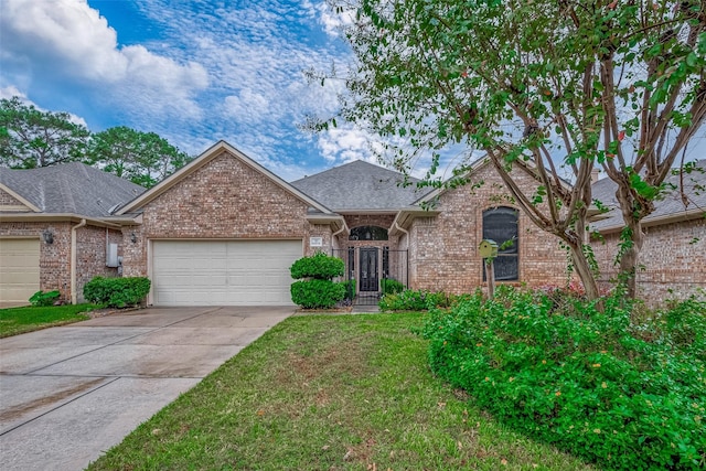 3110 Meadow Oak Dr, Houston, TX 77068 - view of front facade with brick siding, a garage, driveway, roof with shingles, and a front lawn