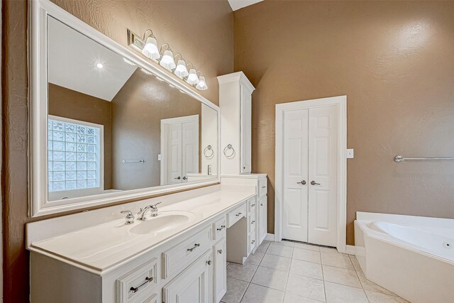 3110 Meadow Oak Dr, Houston, TX 77068 - full bath with vanity, a bath, tile patterned flooring, and vaulted ceiling