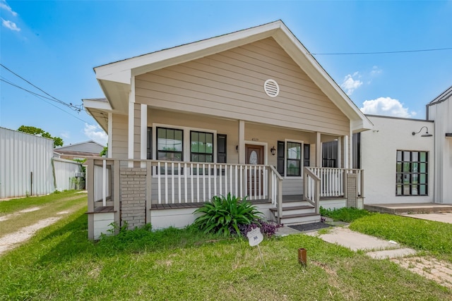 4519 N Main St, Houston, TX 77009 - bungalow with a porch and a front lawn