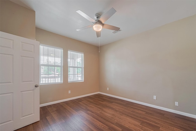 4519 N Main St, Houston, TX 77009 - spare room featuring ceiling fan and dark wood-style flooring