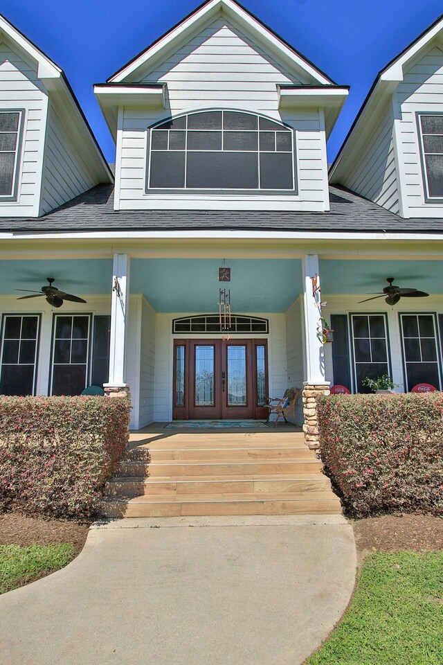 34210 Sanders Ranch Rd, Magnolia, TX 77355 - doorway to property featuring a ceiling fan, a porch, and a shingled roof