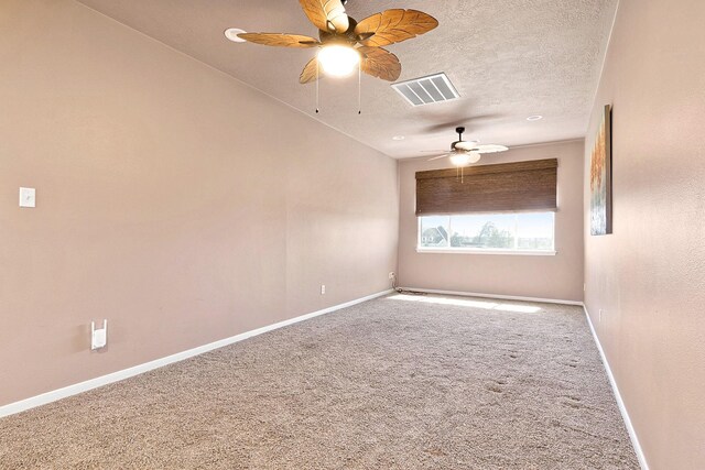 34210 Sanders Ranch Rd, Magnolia, TX 77355 - empty room with carpet flooring, a ceiling fan, and a textured ceiling