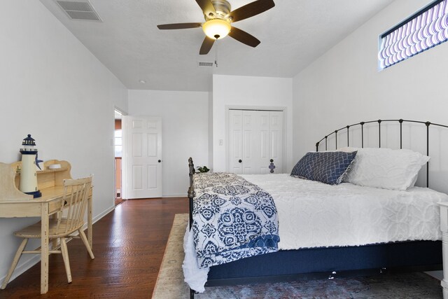 34210 Sanders Ranch Rd, Magnolia, TX 77355 - bedroom featuring dark wood-style flooring, a closet, and a ceiling fan
