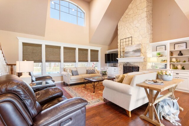 34210 Sanders Ranch Rd, Magnolia, TX 77355 - living room featuring high vaulted ceiling, a fireplace, and dark wood-style floors