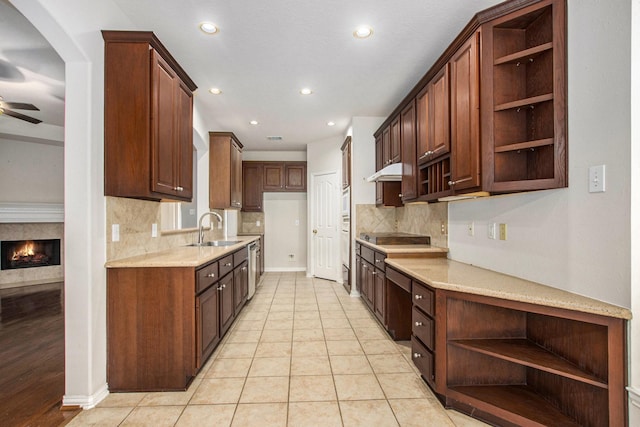 24006 Northshire Ln, Katy, TX 77494 - kitchen with open shelves, a ceiling fan, decorative backsplash, recessed lighting, and under cabinet range hood