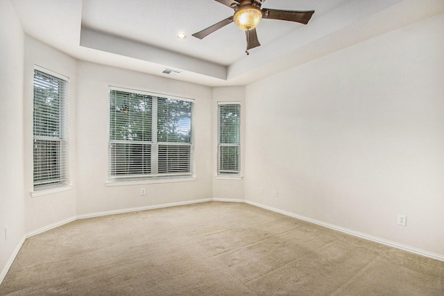 24006 Northshire Ln, Katy, TX 77494 - carpeted empty room with healthy amount of natural light, a tray ceiling, ceiling fan, and recessed lighting