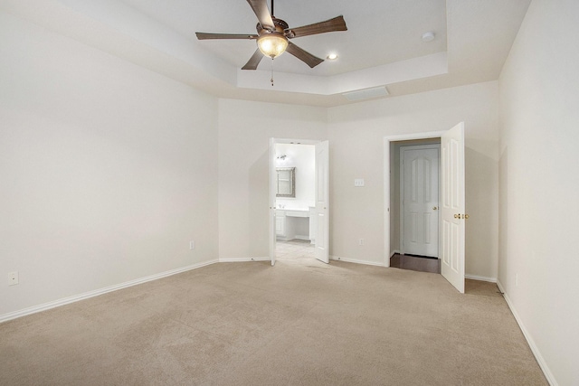 24006 Northshire Ln, Katy, TX 77494 - unfurnished bedroom featuring light carpet, a raised ceiling, connected bathroom, ceiling fan, and recessed lighting