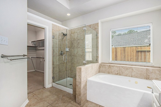 24006 Northshire Ln, Katy, TX 77494 - full bathroom featuring a garden tub, a stall shower, a walk in closet, tile patterned floors, and recessed lighting