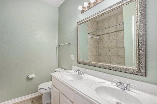 24006 Northshire Ln, Katy, TX 77494 - bathroom with double vanity, tile patterned floors, and a tile shower