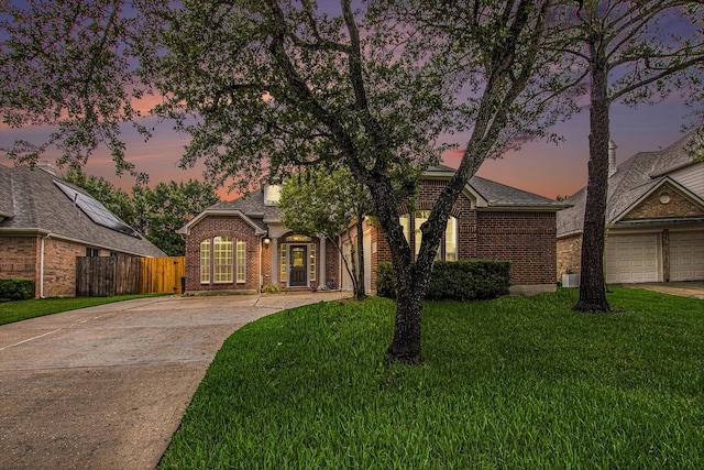 24006 Northshire Ln, Katy, TX 77494 - view of front of house featuring brick siding, driveway, and roof with shingles