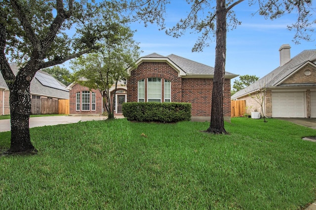 24006 Northshire Ln, Katy, TX 77494 - view of front facade with brick siding, concrete driveway, and a shingled roof
