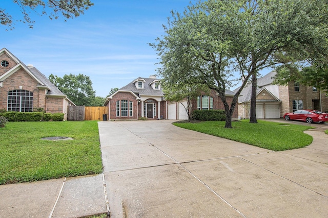 24006 Northshire Ln, Katy, TX 77494 - traditional home with brick siding, concrete driveway, and an attached garage