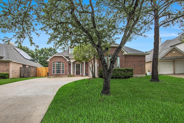 24006 Northshire Ln, Katy, TX 77494 - traditional-style house with driveway, brick siding, and roof with shingles