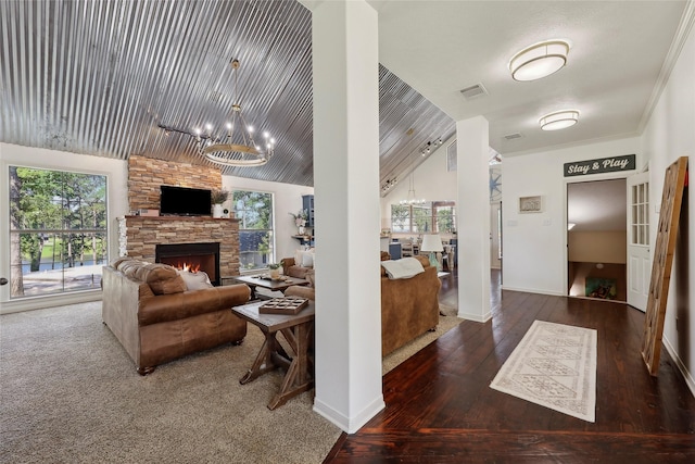 243 Riverbirch, Brookeland, TX 75931 - living room with a chandelier, healthy amount of natural light, hardwood / wood-style floors, vaulted ceiling, and a fireplace