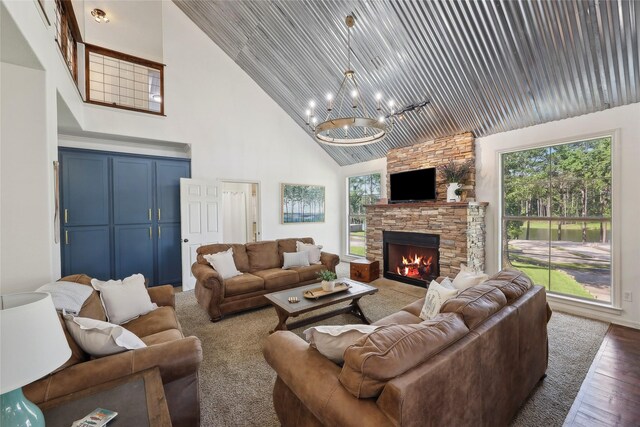 243 Riverbirch, Brookeland, TX 75931 - living room featuring high vaulted ceiling, a chandelier, wood finished floors, a fireplace, and wood ceiling