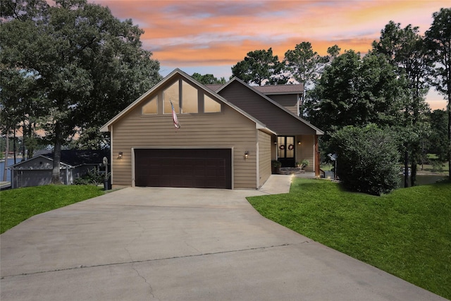 243 Riverbirch, Brookeland, TX 75931 - view of front of property featuring a front lawn, concrete driveway, and a garage