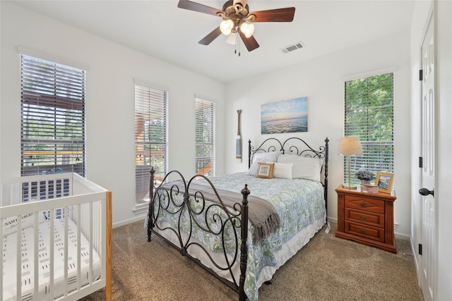 243 Riverbirch, Brookeland, TX 75931 - carpeted bedroom featuring baseboards and a ceiling fan