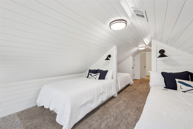 243 Riverbirch, Brookeland, TX 75931 - bedroom with light colored carpet, lofted ceiling, and wood walls