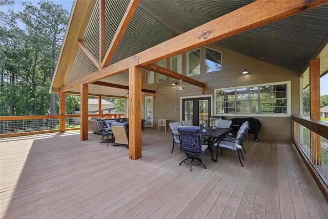 243 Riverbirch, Brookeland, TX 75931 - deck featuring outdoor dining area, french doors, and a ceiling fan