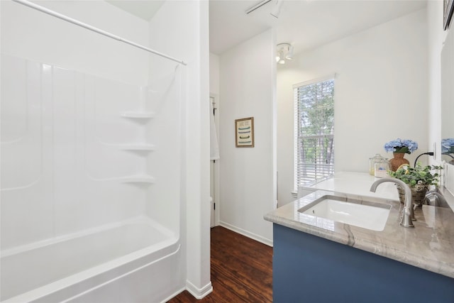 243 Riverbirch, Brookeland, TX 75931 - full bath with vanity, wood finished floors, and shower / washtub combination