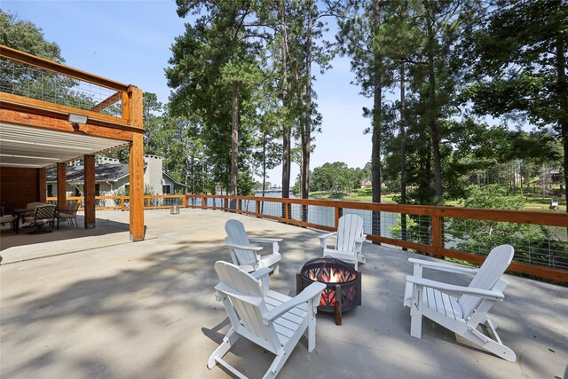 243 Riverbirch, Brookeland, TX 75931 - view of patio with an outdoor fire pit